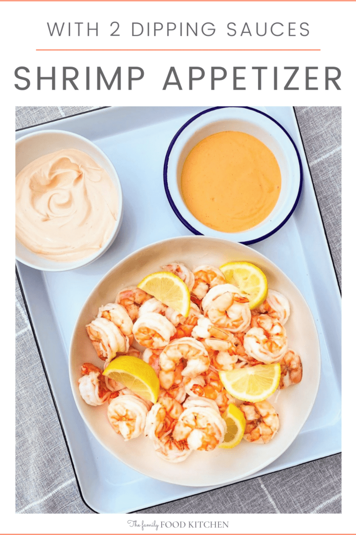 Pinnable image with recipe title and bowl of cooked shrimps with lemon wedges and two bowls of dipping sauces set on a white tray.