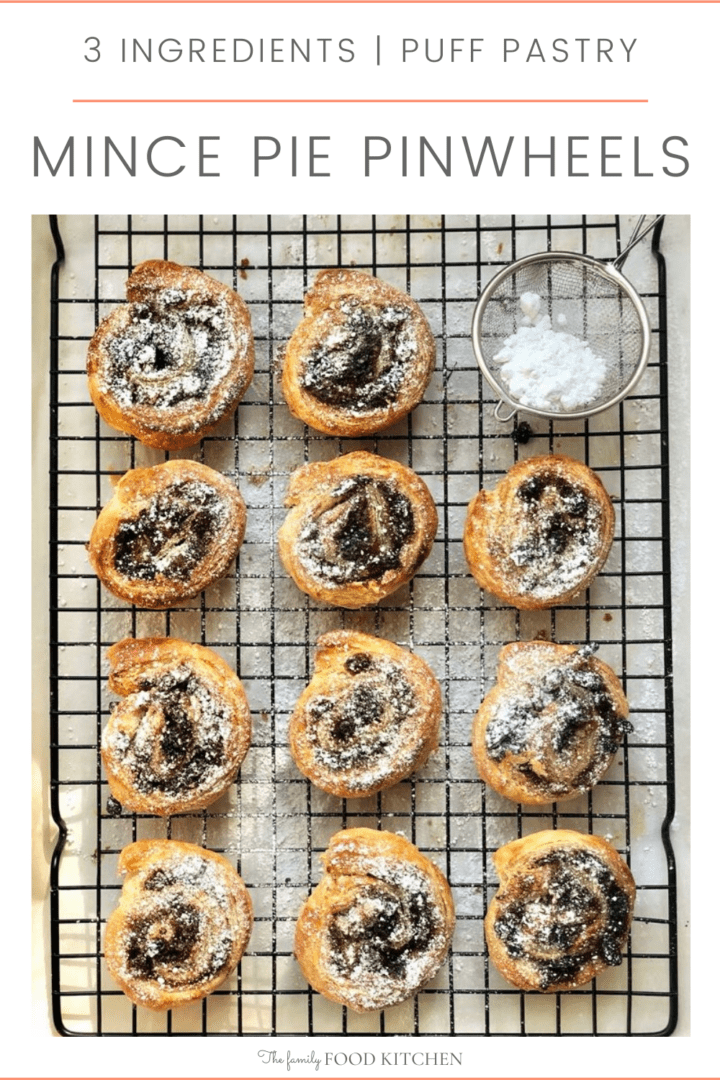 Pinnable image with recipe title and puff pastry swirls filled with mincemeat and dusted with powdered sugar resting on a wire rack.