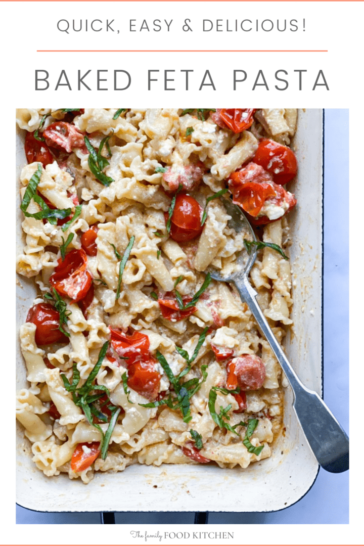 Pinnable image with recipe title and roasting tray with cooked pasta in a creamy feta cheese sauce with roasted tomatoes and fresh chopped basil.