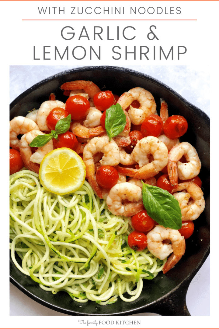 Pinnable image with recipe title and cast skillet with cooked shrimp, cherry tomatoes and zucchini noodles garnished with slices of lemon and basil leaves.