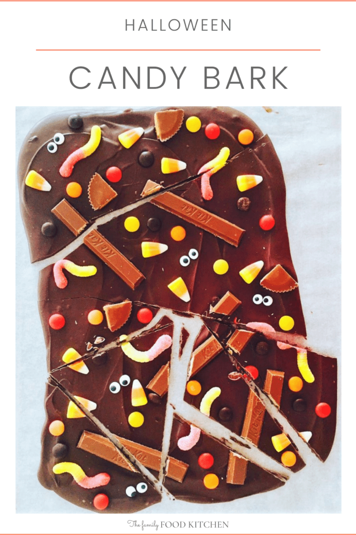 Pinnable image with recipe title and dark chocolate set with a variety of Halloween candy and chocolate bars on top.