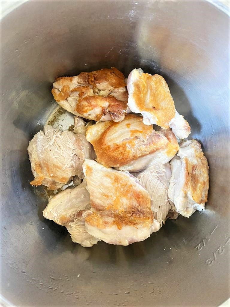 Instant Pot bowl filled with sauted chicken thighs