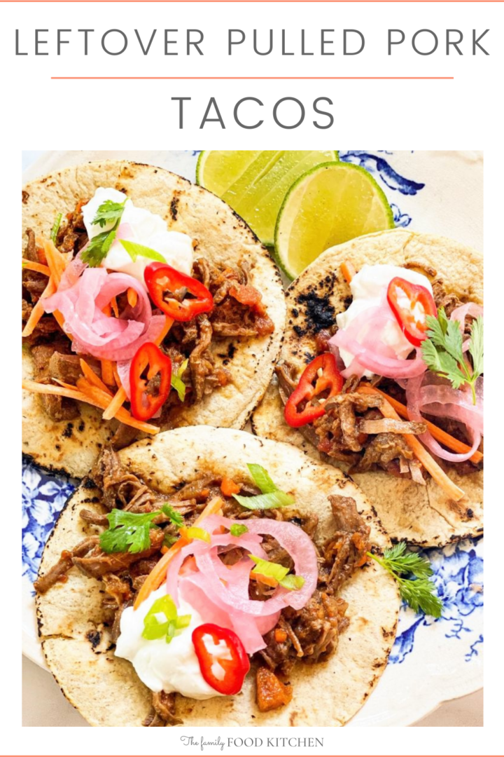 Pinnable image with recipe title and  blue and white plate with 3 flour tortillas topped with pulled pork, pink pickled onion, sliced red chili and cilantro and some wedges of lime.