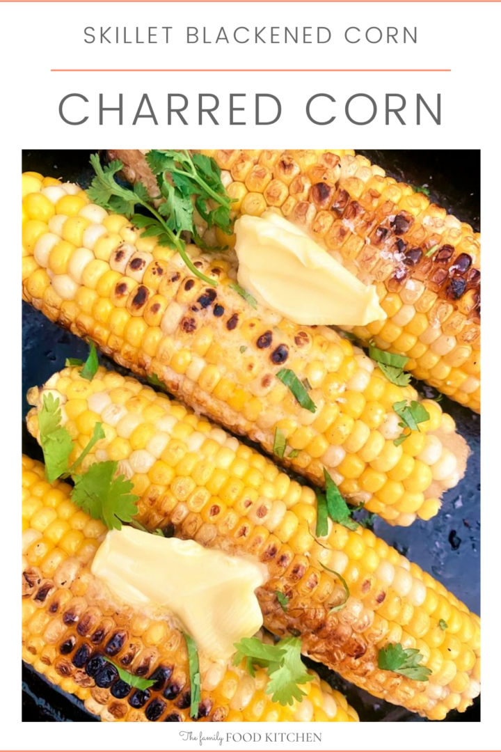 A pinnable image with recipe title and a cast iron skillet with 4 whole ears of charred corn, topped with butter and freshly chopped cilantro