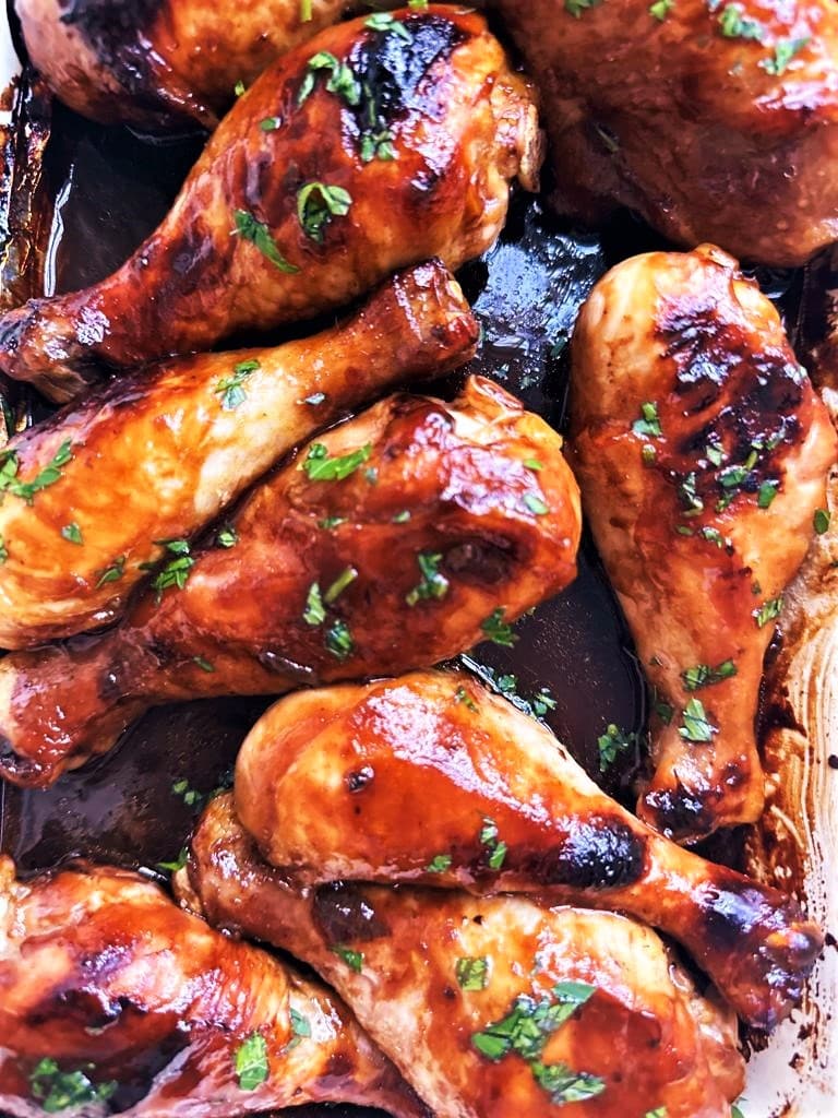 Close up image of cooked sticky soy and honey chicken drumsticks
