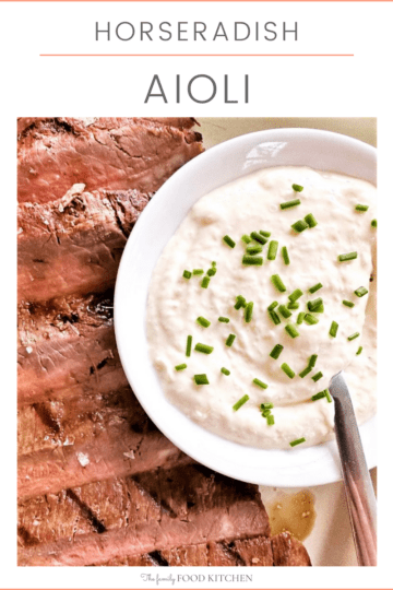 Pinnable image with recipe title and plate of sliced, grilled beef with a bowl of horseradish aioli topped with freshly chopped chives