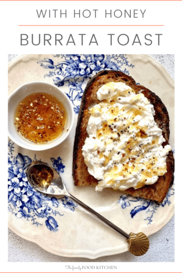 Pinnable image with recipe title and a plate of sourdough toast, topped with burrata cheese and a drizzle of hot honey, with a bowl of honey and red pepper flakes set alongside.