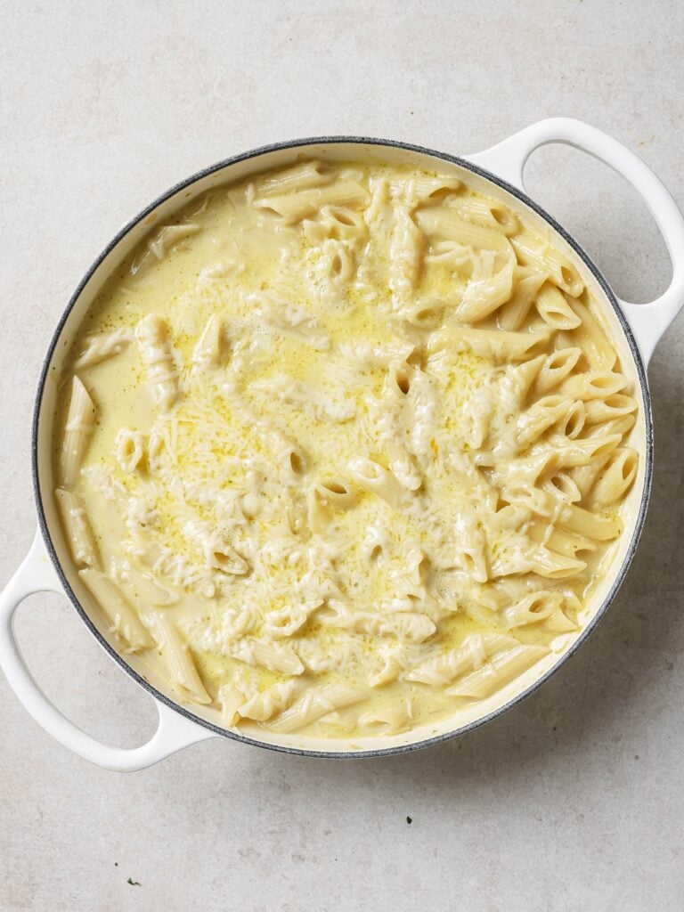 A large skillet of French onion soup pasta with the cheese melted through.