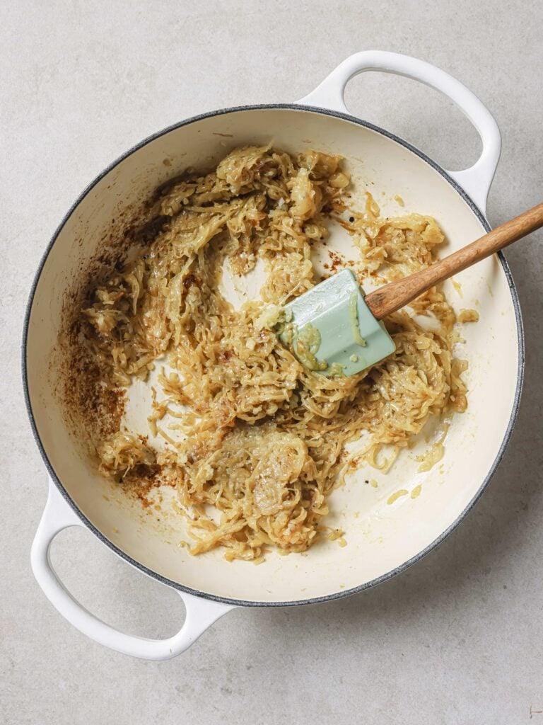 A large skillet of sauteed onions, garlic and reduced white wine.