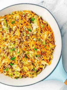 A skillet filled with ground beef and cabbage stirfry.